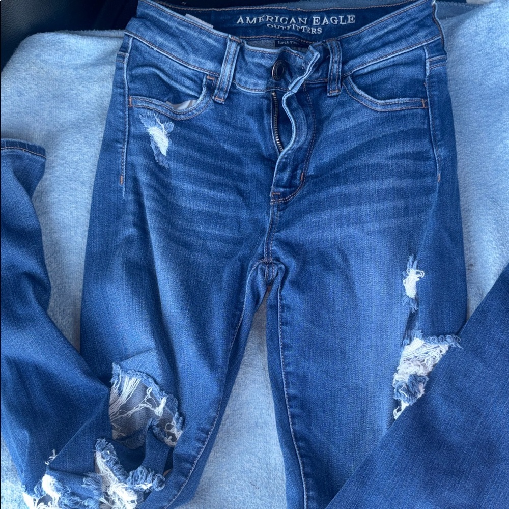 American Eagle Outfitters Dark Blue Distressed Skinny Jeans size 0
